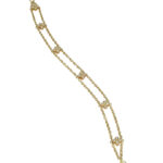 Bracciale in oro giallo con elementi a fiore con quattro diamanti ciascuno