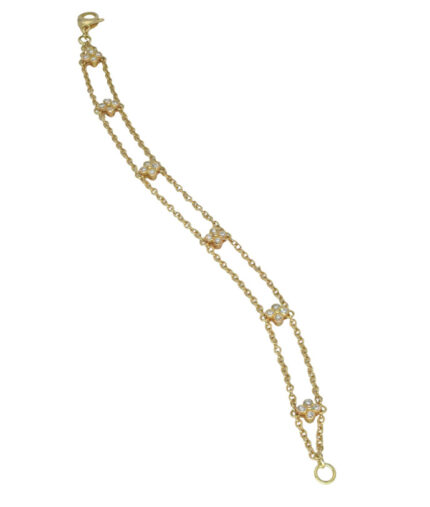 Bracciale in oro giallo con elementi a fiore con quattro diamanti ciascuno