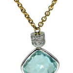 Collana in oro giallo e bianco con ciondolo con acquamarina e diamanti bianchi